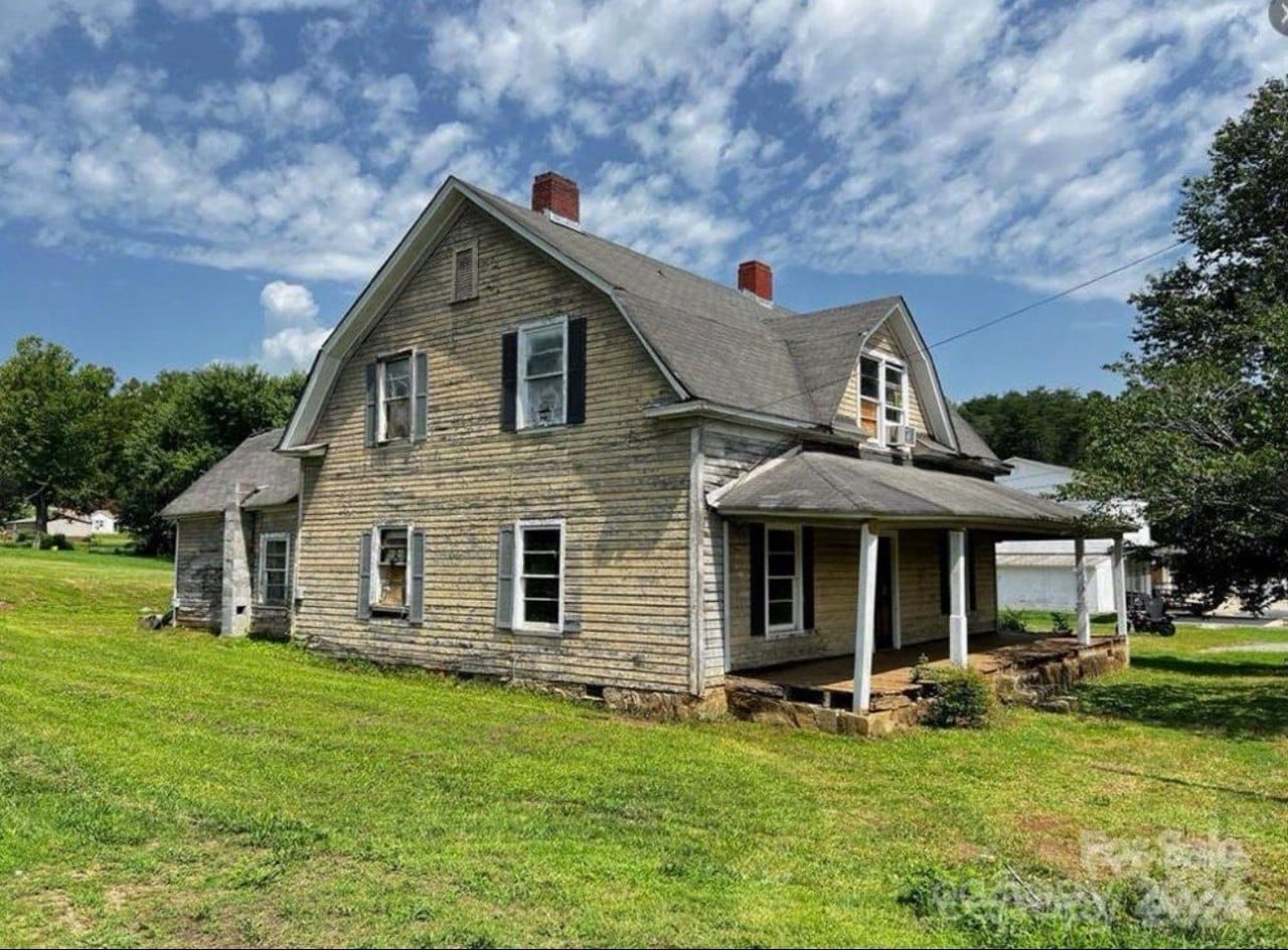 Farmhouse-style siding and deck transformation before